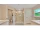 Bathroom featuring a tiled glass shower, tile flooring, granite countertops, and modern fixtures at 130 Nw 113Th Cir, Ocala, FL 34482