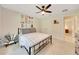 Cozy bedroom showcasing a ceiling fan, carpet flooring, natural light and closet space at 130 Nw 113Th Cir, Ocala, FL 34482