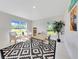 A clean office space with natural light and neutral walls, features tile floors and modern décor at 130 Nw 113Th Cir, Ocala, FL 34482