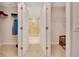 Walk-in closet with double doors, carpet flooring, and wire shelving for optimal storage at 130 Nw 113Th Cir, Ocala, FL 34482