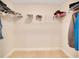 A spacious walk-in closet featuring carpet flooring and wire shelving for efficient storage at 130 Nw 113Th Cir, Ocala, FL 34482