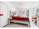 Bright bedroom with a comfortable bed, vanity, and stylish decor, perfect for relaxation at 16082 Sw 24Th Pl, Ocala, FL 34481