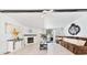 Bright living room featuring a cozy fireplace, stylish decor, and a comfortable brown sofa at 16082 Sw 24Th Pl, Ocala, FL 34481