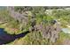 Picturesque aerial view showcasing lush greenery, trees, and a waterfront area offering a serene and natural setting at 22535 Sw 117Th St, Dunnellon, FL 34431