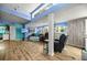 Inviting living room with hardwood floors, skylight, and a cozy seating area perfect for relaxation and entertainment at 22535 Sw 117Th St, Dunnellon, FL 34431