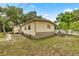 The back of the home showcases the home's vinyl siding and access ramp at 22535 Sw 117Th St, Dunnellon, FL 34431
