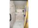 This modern shower features marble-style walls, dual shelves and shower heads with a yellow curtain at 22535 Sw 117Th St, Dunnellon, FL 34431