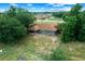 Drone shot of the back of the house with a view of the backyard and patio at 263 Chestnut Rd, Ocala, FL 34480