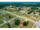 Expansive aerial view of the property showcasing the neighborhood and surrounding landscape at 263 Chestnut Rd, Ocala, FL 34480
