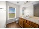 Bathroom featuring wood-style flooring, vanity with sink, and a window providing natural light at 263 Chestnut Rd, Ocala, FL 34480