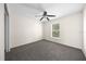 Cozy bedroom featuring neutral carpet and a window, creating a comfortable and inviting space at 263 Chestnut Rd, Ocala, FL 34480