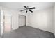 Bedroom featuring neutral carpet and closet, with an open doorway to the hall at 263 Chestnut Rd, Ocala, FL 34480