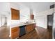 Kitchen featuring modern appliances, wood cabinets, and hardwood floors at 263 Chestnut Rd, Ocala, FL 34480