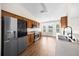 Updated kitchen with modern appliances, wood cabinets, and hardwood floors at 263 Chestnut Rd, Ocala, FL 34480