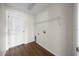 Laundry room features laminate flooring, shelving, and hookups for washer and dryer at 263 Chestnut Rd, Ocala, FL 34480