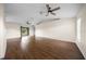Open living room featuring hardwood floors, ceiling fans and natural light at 263 Chestnut Rd, Ocala, FL 34480