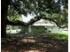 Backyard, with a spacious yard and mature trees at 2810 Se Lake Weir Ave, Ocala, FL 34471