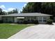 Charming single-story home with a well-manicured lawn and inviting curb appeal at 2810 Se Lake Weir Ave, Ocala, FL 34471