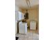 Bright laundry room with appliances and upper cabinets at 2810 Se Lake Weir Ave, Ocala, FL 34471