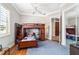 Comfortable bedroom featuring a bunk bed, area rug, hardwood floors, and window with plantation shutters at 3986 Se 43Rd Cir, Ocala, FL 34480