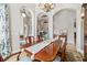 Well-lit dining room boasting elegant lighting and a large table at 3986 Se 43Rd Cir, Ocala, FL 34480