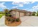 Charming single-story home with a lush lawn, mature landscaping, and a convenient two-car garage at 3986 Se 43Rd Cir, Ocala, FL 34480