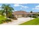 Exterior view with a driveway and a basketball hoop at 3986 Se 43Rd Cir, Ocala, FL 34480