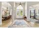 Welcoming foyer with tile flooring, elegant lighting, and views of the dining and living areas at 3986 Se 43Rd Cir, Ocala, FL 34480