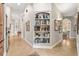 Hallway featuring built-in bookcase and tile flooring at 3986 Se 43Rd Cir, Ocala, FL 34480