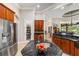 A kitchen boasts stainless steel appliances and granite countertops, featuring a walk-in pantry at 3986 Se 43Rd Cir, Ocala, FL 34480
