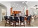 Open kitchen with dark granite countertops, seating, and stainless-steel appliances at 3986 Se 43Rd Cir, Ocala, FL 34480