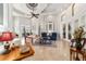 Open living space with tile flooring, comfortable seating, and seamless flow throughout at 3986 Se 43Rd Cir, Ocala, FL 34480