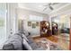 Comfortable living room showcasing a large sofa, stylish rug, and mirrored closet at 3986 Se 43Rd Cir, Ocala, FL 34480