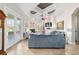 Cozy living room featuring a fireplace, coffered ceiling, and glass doors to backyard at 3986 Se 43Rd Cir, Ocala, FL 34480
