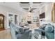 Well-decorated living room offering a fireplace, coffered ceiling, and access to outdoor areas at 3986 Se 43Rd Cir, Ocala, FL 34480