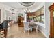 Spacious living areas featuring tile floors, coffered ceilings, and natural light with views to backyard at 3986 Se 43Rd Cir, Ocala, FL 34480