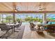 Spacious covered patio with dining and seating areas, perfect for outdoor entertaining overlooking the pool at 3986 Se 43Rd Cir, Ocala, FL 34480