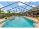 A screened-in pool and patio offer a luxurious outdoor living space and relaxing spa experience at 3986 Se 43Rd Cir, Ocala, FL 34480