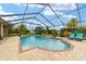 Relax in the screened-in pool area with a tranquil spa and patio, perfect for outdoor enjoyment at 3986 Se 43Rd Cir, Ocala, FL 34480