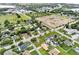 Aerial view of neighborhood featuring mature trees, well-manicured lawns, and community proximity at 460 E Haines Blvd, Lake Alfred, FL 33850