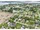 Aerial view of neighborhood featuring the property's location within a residential area with mature trees at 460 E Haines Blvd, Lake Alfred, FL 33850