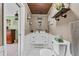 Elegant bathroom boasts modern fixtures, stylish vanity, and a classic wood ceiling at 460 E Haines Blvd, Lake Alfred, FL 33850