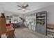 Bright bedroom features multiple windows, ceiling fan, built in bookshelves, and desk area at 460 E Haines Blvd, Lake Alfred, FL 33850