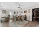 Cozy dining room with modern decor, a rustic light fixture, and comfortable seating for a warm and inviting ambiance at 460 E Haines Blvd, Lake Alfred, FL 33850