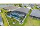 Aerial view of the screened-in pool, showcasing its design, layout, and integration with the home's outdoor space at 488 Seth Run, The Villages, FL 32163