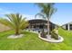 A spacious screened pool area with lush landscaping, offering a private retreat for relaxation and enjoyment at 488 Seth Run, The Villages, FL 32163