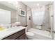 The bathroom features a bathtub and shower with gray tile, and modern vanity with white basin sink and modern faucet at 488 Seth Run, The Villages, FL 32163