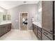 Spacious bathroom with double vanities, tile floor, and ensuite at 488 Seth Run, The Villages, FL 32163