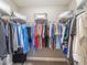 Walk-in closet with wire shelving and ample storage for clothes at 488 Seth Run, The Villages, FL 32163