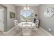 Bright dining area featuring a round table and natural light from a large window at 488 Seth Run, The Villages, FL 32163
